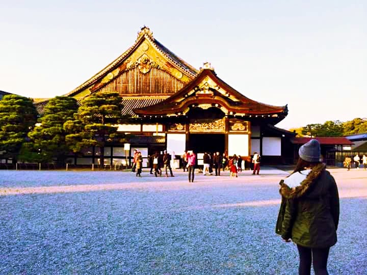 A Girl in Front of a Temple - How to Travel With Chronic Depression